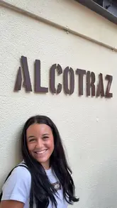 A couple visits the Alcotraz prison-themed cocktail bar, showcasing the immersive experience of wearing jumpsuits, interacting with actors playing prison guards, and having custom cocktails made from alcohol they smuggled in.