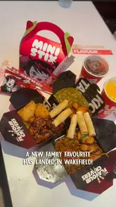 A family visits a new Chopstix Noodle Bar location in Wakefield, showcasing the exterior, interior, the ordering process, and the food. The video highlights the family-friendly atmosphere and the casual dining experience.