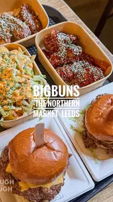 A vlog-style review of Big Buns at The Northern Market in Leeds, featuring a variety of burgers, chicken wings, and loaded fries.