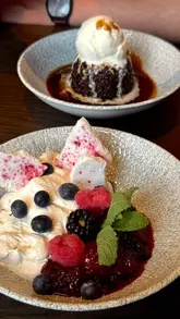 A 'week in the life' vlog featuring various activities in St Andrews, including shopping, Pilates, dining at Saints Sizzle and The Jigger Inn, visiting the Edinburgh Fringe, the Johnnie Walker Experience, and a golf lesson.