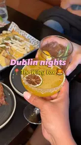 A fast-paced, energetic reel showcasing a night out at The Wiley Fox in Dublin, featuring a variety of comfort foods like smash burgers, nachos, and wings, alongside cocktails and Guinness.