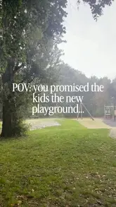 A short, handheld vlog documenting a visit to the new playground at Woodbank Park on a rainy Bank Holiday Monday, featuring the creator and their child.