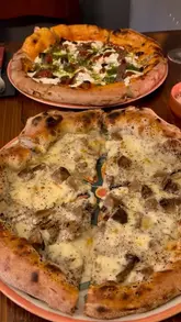 A promotional reel for Due Forni in Beaconsfield, featuring close-ups of artisanal pizzas, the pizza-making process by the chef, the restaurant interior, and the creator enjoying the meal.