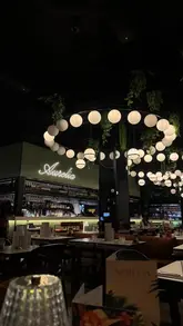 A montage video showcasing a visit to Aurelia, featuring shots of the restaurant interior, a sharing platter, cocktails, a Wagyu steak, pasta, and tiramisu.