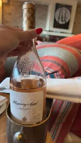 A montage of a dinner experience at Rick Stein Sandbanks, featuring various dishes, cocktails, and the restaurant's interior.