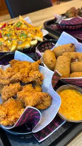 A food review reel showcasing various dishes from the new menu at Flakes Diner in Portlethen, including burgers, chicken, fries, and desserts.