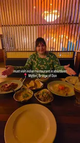 A promotional video for Mythri, an Indian restaurant in Aberdeen, showcasing the interior decor and a variety of vegan Indian dishes.