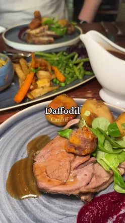 Enjoying a delicious Sunday lunch at Daffodil in Cardiff, featuring surf & turf skewers and Welsh pork loin.