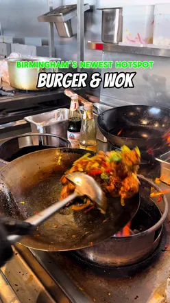 People enjoying burgers and Asian-inspired dishes at Burger & Wok, Birmingham's newest dining hotspot.
