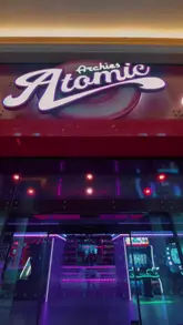 Enjoying bold burgers and loaded fries at Archie's Atomic Trafford in Manchester's vibrant gaming venue.