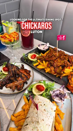 Diners enjoying delicious chicken dishes at Chickaros Luton, a top halal dining spot. #FoodieFinds #MustTryEats