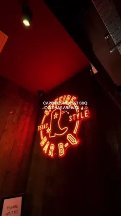 Delicious BBQ spread at Spitfire in Cardiff, featuring St Louis ribs, pork belly burnt ends, and pork rashers.