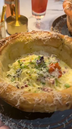 Couple dining at Sannio Italian Restaurant in Glasgow before a Shrek show at King’s Theatre, enjoying delicious food.