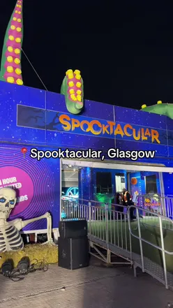 Family enjoying rides and treats at Spooktacular event in Glasgow, perfect for all ages this Halloween season.