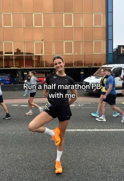 Runner celebrating a personal best time with PUMA shoes at a race event, grateful to SportsShoes for the opportunity.