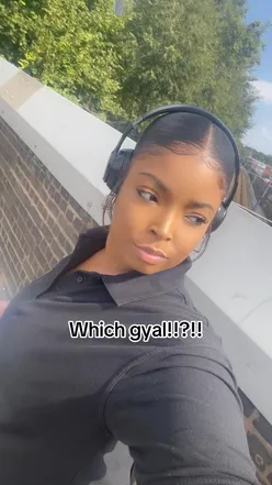 Two friends enjoying a fun moment and posing for a photo outdoors, showcasing a vibrant atmosphere.