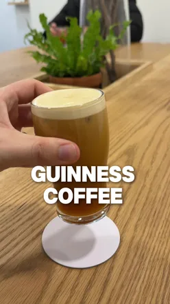 Artista Perfecto coffee shop in Manchester serving unique coffee resembling a pint of Guinness, with diverse blends available.