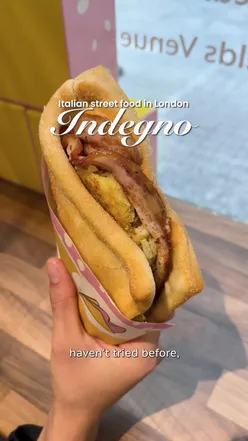 Trying La Crescentina 2.0, a delicious Italian snack, at Spitalfields in London. Perfect for on-the-go eating!