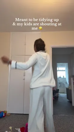 Person enjoying the Milarrochy shake while avoiding chores, showcasing a playful moment