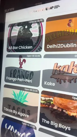 Delicious takeout feast at Hosted Kitchens in Glasnevin, featuring chicken gyro, loaded fries, and a chicken burger.