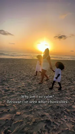 Calm mother reflecting on strength and peace for her kids amidst chaos, emphasizing protective love and resilience.