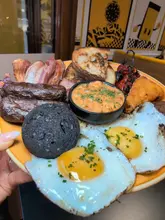 Delicious Daveys Breakfast spread featuring avocado, eggs, French toast, lattes, and more in Newcastle.