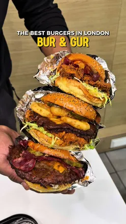 THE BEST BURGERS IN LONDON!! 🍔 @BUR & GUR - Burgers & Shakes  ‘Explore our diverse and mouth-watering menu, crafted with fresh ingredients and love. From juicy burgers to crispy fries, we have something to satisfy every craving. Discover your next favorite bite with us!’ Our Order: • The Burgur • Signature Smash • Big Billy Buttermelt • The Buttermelt Truffle • Truffle Buttermelt Strips • The BBQ Buttermelt Strips • Mac & Cheese Bites • Onion Rings • Truffle Parmesan Fries • Cheesy Fries • Biscoff Milkcake • Kinder Milkcake • Biscoff Banana Milkshake • Strawberry Mojito • Blueberry Mojito • Pacha Lychee #londonfood #burandgur #placestoeat #halalfoodlondon #fyp 