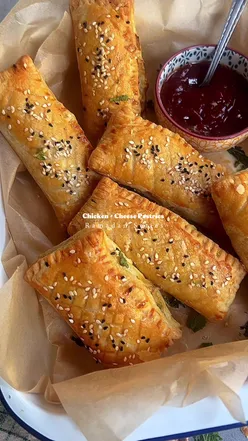 ✨Ramadan Recipes✨ Chicken and Cheese Pastries                  Ingredients  500g boiled & shredded Chicken 1tbsp oil 2tbsp butter  1tbsp garlic paste 1 chopped onion  1tsp black pepper powder 1tsp red chili flakes 1tbsp soy sauce 1tbsp vinegar 1/2tsp cumin powder 1tsp coriander powder 2-3 chopped green chilies  2 chopped green pepper 2tbsp flour 150ml double cream 200g cheese 1/2 cup chopped coriander 2 green part of spring onions Puff Pastry Beaten Egg Sesame seeds Method  1.In a pan, heat oil and melt the butter. Add garlic paste and sauté for a minute. Add the chopped onions and cook until soft. 2.Stir in the shredded chicken and season with black pepper, red chili flakes, soy sauce, vinegar, cumin powder, coriander powder, green chilies, and green pepper - mix well. 3.Add flour to the mixture and cook for 2 minutes. Stir in the double cream. 4 Add the cheese, fresh coriander, and spring onions. Transfer to a bowl and let it cool. 5.Roll out the puff pastry sheets and spoon in the chicken filling - seal the edges with a fork. 6.Use a pizza cutter to make small cuts on top of the pastry. 7.Brush the top of each pastry with the beaten egg wash and sprinkle with sesame seeds. 8.Preheat your oven to 200° and bake the pastries until golden brown and puffed up. #recipes #chickenpastries #iftar #ramadanrecipes #ramadan 