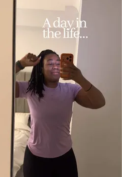 Londoner reflecting on self-care and personal growth in a cozy urban setting