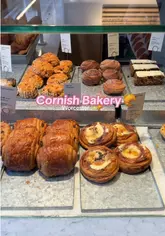 A short, upbeat video showcasing a visit to a Cornish Bakery location in Worcester. The video features close-ups of various pastries, a sandwich, and hot drinks, followed by a shot of the creator enjoying the food, and concludes with exterior shots of the bakery.