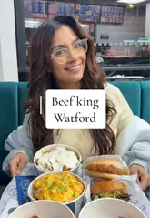 A fast-paced, energetic review of Beef King in Watford, featuring two creators trying a variety of items including smash burgers, chicken rice boxes, curly fries, wings, and desserts. The video focuses on the quality of the food and the signature sauces, encouraging viewers to visit.