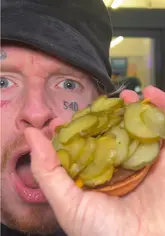 A fast-paced review of new McDonald's menu items, including a pickle-heavy burger, a chicken burger, and a McFlurry with nuggets. The creator visits a McDonald's location, uses the self-service kiosk, and provides a direct, enthusiastic critique of the food.