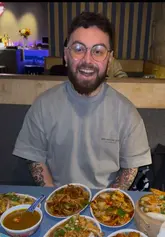 A fast-paced review of a Chinese restaurant where the creator and his companion order a wide variety of dishes using a tick-box menu system. The video features close-ups of various popular Chinese dishes, including duck pancakes, ribs, and dim sum, alongside mocktails, providing a clear sense of the dining experience.