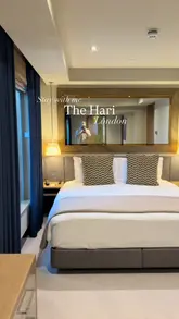 A short, stylish video showcasing a stay at The Hari London, featuring shots of the hotel room, bathroom, and dining experience.