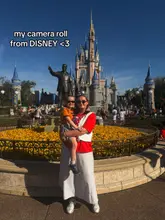 A photo of a woman holding a child in front of Cinderella's Castle at Disney World, with text overlay indicating it is a camera roll dump.