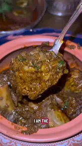 A review of Ambassador's Clubhouse in London, highlighting their Michelin-starred Punjabi cuisine. The creator showcases various dishes including jumbo wild prawns, butter chicken chops, and lamb curries, while also commenting on the upscale interior and cocktail offerings.