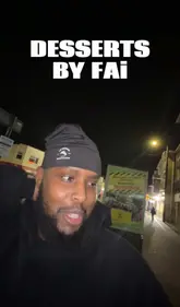 A creator visits a street-side dessert stall run by sisters, reviewing their dessert cups and chai. The video is shot in a vlog style at night, focusing on the creator's enthusiastic reaction and interaction with the business owners.