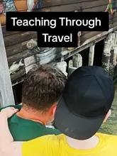 A family travel vlog featuring a walk along the Chew Jetty in Georgetown, Penang. The video captures the father and son observing the local architecture, specifically the wooden stilts and the street art painted on the side of the buildings over the water.
