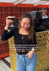 A fast-paced, handheld-style video showcasing a bottomless brunch experience at a London rooftop venue. The footage highlights the social atmosphere, including live music, a DJ, and groups of friends enjoying cocktails and small plates, effectively conveying the venue's 'vibey' nature.