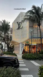 A montage of high-end Miami locations, including luxury retail, beach scenes, a hotel room, a bar, and nightlife, set to music with minimal text overlay.
