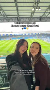 The video follows two creators as they experience a private hospitality box at Elland Road for a Leeds United match. It captures the view of the pitch, the interior of the box, and the various food and drink offerings provided throughout the day, including a roast dinner, pies, and cream tea.