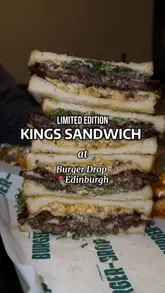 A short, energetic video showcasing a limited edition 'Kings Sandwich' collaboration at Burger Drop in Edinburgh. The video features close-up shots of the stacked burger being dipped in gravy, alongside loaded fries and drinks, set to music with text overlays.