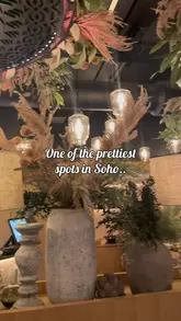 A review-style video showcasing a Lebanese dining experience in Soho, featuring a variety of starters, a mixed grill main course, and traditional desserts.
