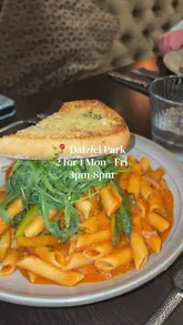 A personal video review of a meal at Dalziel Park, featuring shots of the menu, the restaurant interior, and various dishes including pasta, chicken, fajitas, and dessert.