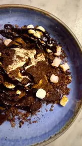 A promotional video showcasing the 'Waffle Week' menu at Duck & Waffle, featuring various savory and sweet waffle-based dishes like waffle pizza, doner kebab, and dessert waffles.