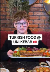 A food review video where the creator visits a Turkish restaurant in Southampton to determine if it lives up to the hype. The video features a variety of dishes including hot and cold meze platters, pide, a combination kebab, tavuk sote, and baklava, alongside drinks like ayran and a Ferrero Rocher milkshake.