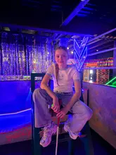 A fast-paced montage showcasing the various activities available at HUKD Golf, including crazy golf and sports simulators, followed by a brief look at the food on offer.