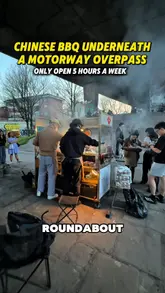 A review of a unique street food stall located under a motorway overpass in Manchester, specializing in Chinese BBQ skewers. The video highlights the limited opening hours, the smoky atmosphere, and the variety of skewers available, including beef, chicken, and pig intestines.