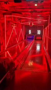 A fast-paced montage showcasing the various games and bar area at Lane 7 in Birmingham, highlighting the venue's energetic atmosphere and competitive socialising options.