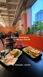 A short, energetic video featuring a visit to Shokupan in Birmingham, focusing on their signature katsu-style sandwiches and fries within a modern, casual dining environment.